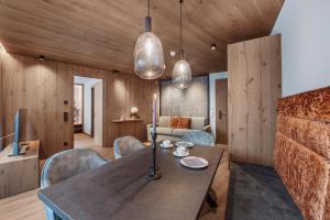 a dining room with a table and chairs at Chalet Fliana Deluxe in Ischgl