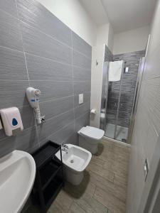 a bathroom with a toilet and a sink at B&B Benvenuti al Sud in Crotone +65 photos