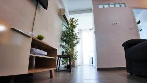 a living room with potted plants on the wall at Apartalux Vera Rincón de Loix in Benidorm +32 photos