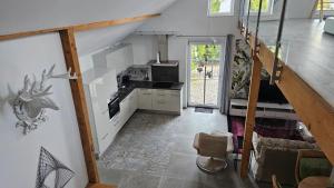 a kitchen with a staircase with a deer on the wall at Ferienhaus Meli in Pürgen