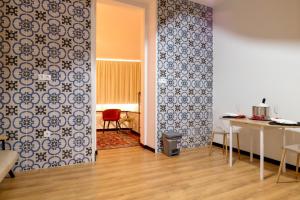 a living room with blue and white tiles on the wall at Davila Peixinho 204 in Aveiro +31 photos