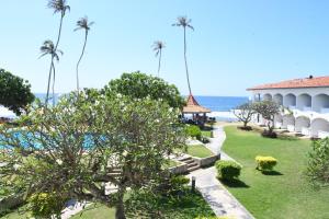 a view of the ocean from the balcony of a resort at Hotel Lanka Super Corals in Hikkaduwa