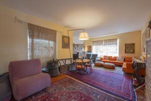 a living room with a couch and a table at Approdo Boutique Hotel Leuca in Leuca
