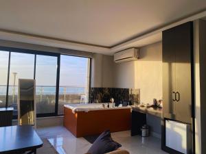 a kitchen with a sink and a large window at Elite Marmara Bosphorus Çamlıca in Istanbul