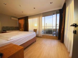 a bedroom with a large bed and a large window at Elite Marmara Bosphorus Çamlıca in Istanbul +88 photos
