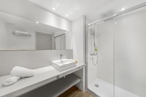 a bathroom with a sink and a shower at Tacande Portals in Portals Nous