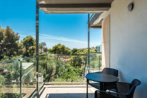 a balcony with a table and a view at Tacande Portals in Portals Nous