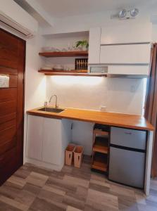 a kitchen with a sink and a counter top at CiNta Hotel in Boracay