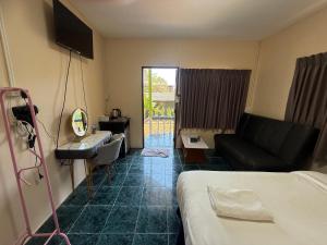 a hotel room with a bed and a couch at Searide hotel in Ao Phutsa