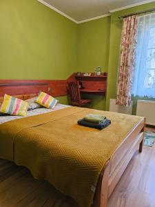 a bedroom with a bed and a desk in a room at POD ORŁEM in Wałcz +57 photos
