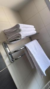 a towel rack with towels on it in a bathroom at דירה 9 in Eilat