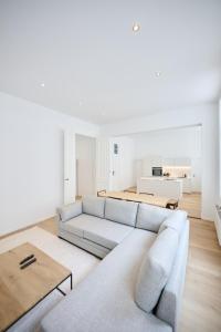 a living room with a couch and a table at Louise City 2 in Brussels +11 photos