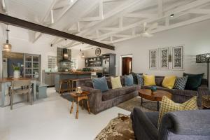 a living room with couches and a kitchen at The Oyster Shack by The Oyster Collection in Kenton on Sea +43 photos