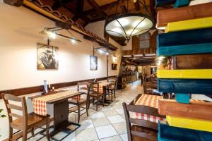 a restaurant with tables and chairs in a room at East City Budapest in Budapest