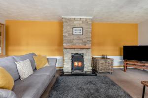 a living room with a couch and a fireplace at 2 Bed in Wool oc-r29949 in Wool