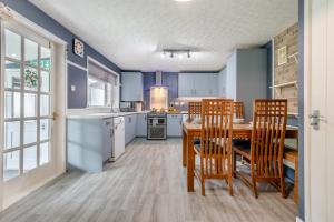 a kitchen and dining room with a table and chairs at 2 Bed in Wool oc-r29949 in Wool