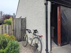 a bike is parked outside of a building at 3 Bed in Portinscale oc-w31059 in Portinscale