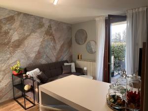 a living room with a couch and a table at Elite in Rovigo