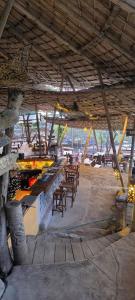 a patio with tables and chairs in a building at Coco Tent Seaview 360 in Ko Lanta