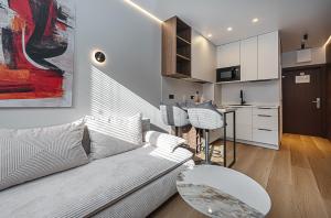 a living room with a couch and a table at Vilnius City Hotel in Vilnius +65 photos