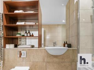 a bathroom with a sink and a toilet at Contractors - Free Parking - City Centre - Balcony - x21 in Hull +72 photos