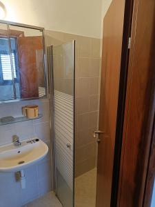 a bathroom with a sink and a shower at sitbonim in Netanya +4 photos