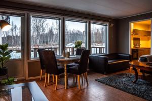 a living room with a table and chairs at Apartment in Senja in Senja