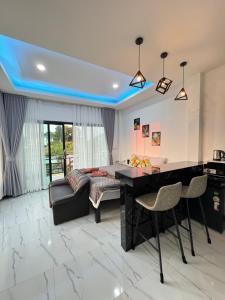 a living room with a desk and a couch at Seaview phuwamin in Ko Lanta
