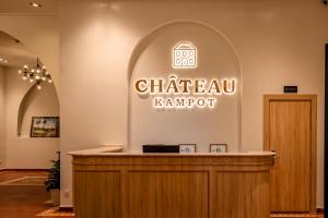 a sign for a chateau karmort in a building at Chateau Kampot in Kampot +94 photos
