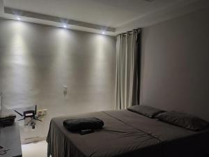 a bedroom with a bed in a room at Pousada Horbis in Guarabira