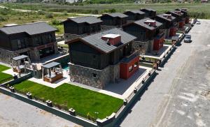 an aerial view of a large house with a yard at champion villas in Ortaca +2 photos