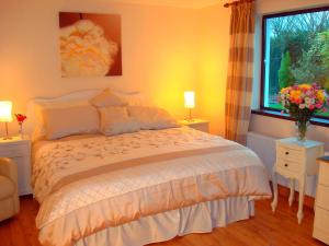A bed or beds in a room at Athlumney Manor Guest Accommodation