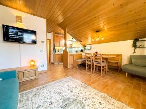 a living room with a couch and a table at Begar Nest - ski slope front and panoramic in Sappada