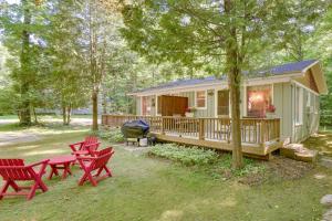 a house with picnic tables and chairs in the yard at 'Pine Cottage' Duplex w/ Deck: Walk to State Park! in Ephraim