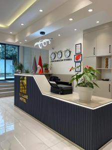a lobby of a store with a reception counter at Sky Luxe Hotel Konyaaltı in Antalya