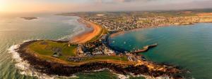 an aerial view of a beach and the ocean at The Captains Wheel in Skerries