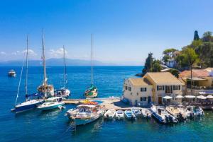 a group of boats are docked in a harbor at Villa Old Vineyard in Kontogiannátika