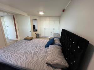 a bedroom with a large bed with pillows on it at The Anchor in Skerries
