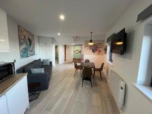 a living room with a couch and a table at The Anchor in Skerries