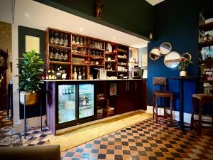 a bar in a restaurant with a counter and chairs at The Earlsdale Bed and Breakfast in Ilfracombe