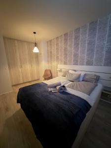 a bedroom with a large bed in a room at Cozy ocean front apartment in Reykjavík