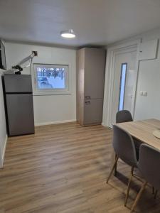 a room with a table and chairs and a window at Hiška Moravska ravnica in Moravske-Toplice