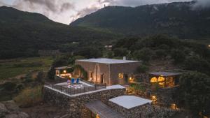 an aerial view of a house in the mountains at Dammuso del Nonno in Pantelleria