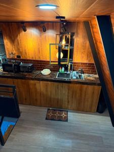 a kitchen with a sink and a counter top at Tasha's Place in Antipolo