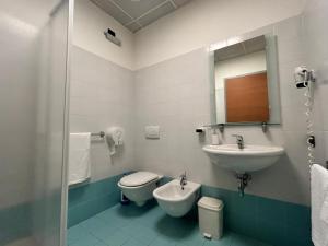 a bathroom with a sink and a toilet and a mirror at The Polo Hub in Mortara +45 photos