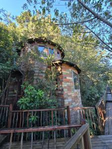 a brick building on a wooden deck at Aremko Aguas Calientes & Spa in Puerto Varas