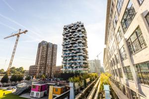 a rendering of a tall building in a city at Holiday Inn Eindhoven Centre by IHG in Eindhoven