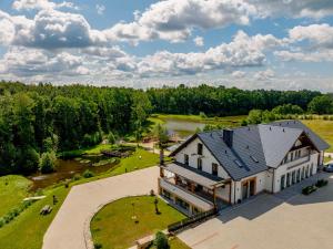 an aerial view of a large house with a large yard at Dębowy Dwór, Wędkowanie, Stawy, Agroturystyka in Łagiewniki