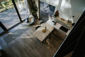 an overhead view of a living room with a table at Lake Forest Kabin in Bárdudvarnok