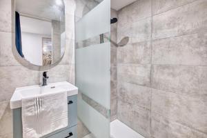 a bathroom with a sink and a mirror at Les gîtes du Gauliat in Espartignac +60 photos